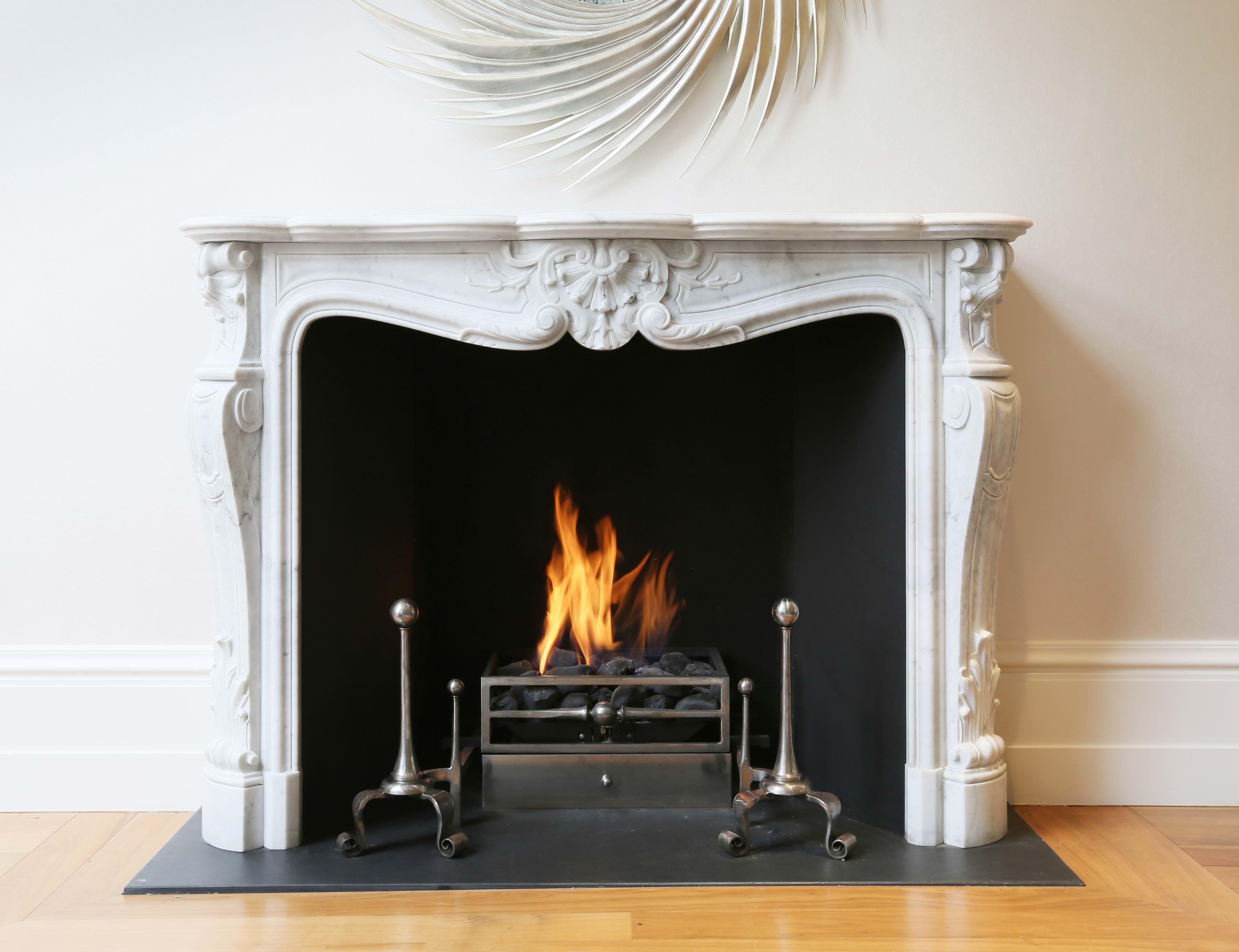 gas fire with ornate white surround